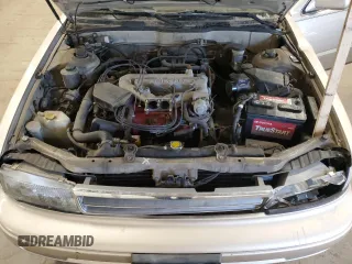1990 Nissan Maxima z VIN JN1HJ01PXLT401797, wystawiony jako Copart lot #47868945 z przebiegiem Nie podano mil oraz Szkody całkowita. Historia ofert i sprzedaży dostępna na DreamBid. Obrazek 11.