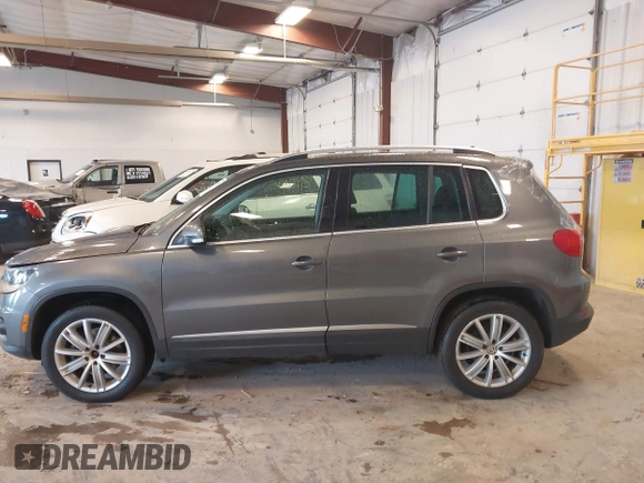 2012 Volkswagen Tiguan SE with VIN WVGBV7AX6CW093750, listed as a IAAI auction lot 42329775 with 117,509 mi miles and . Bid and sale history available at DreamBid. Image 14.