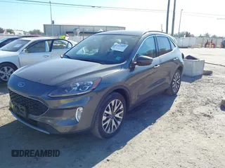 2020 Ford Escape Titanium with VIN 1FMCU9J9XLUA66440, listed as a IAAI auction lot 41464049 with 57,626 mi miles and . Bid and sale history available at DreamBid. Image 17.