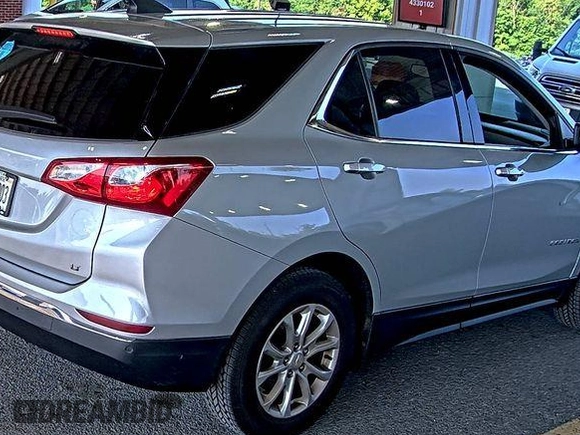 2020 Chevrolet Equinox LT z VIN 2GNAXJEV5L6230548, wystawiony jako IAAI lot #42573168 z przebiegiem 95 519 mil mil oraz . Historia ofert i sprzedaży dostępna na DreamBid. Obrazek 3.
