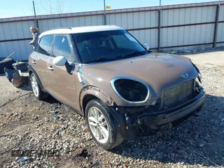 2014 MINI Countryman S with VIN WMWZC3C5XEWP52054, listed as a IAAI auction lot 41452354 with 104,873 mi miles and . Bid and sale history available at DreamBid. Image 1.