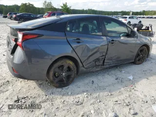 2022 Toyota Prius L Eco z VIN JTDKAMFU8N3173133, wystawiony jako Copart lot #54865615 z przebiegiem 100 876 mil mil oraz Szkoda całkowita • Salvage title. Historia ofert i sprzedaży dostępna na DreamBid. Obrazek 3.