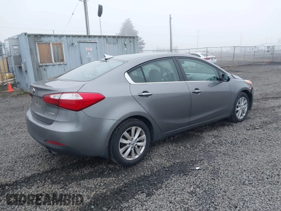 2014 Kia Forte EX with VIN KNAFX4A8XE5213014, listed as a IAAI auction lot 41000589 with 89,890 mi miles. Bid and sale history available at carsss.com. Image 4.