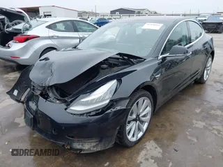 2018 Tesla Model 3 Long Range Battery with VIN 5YJ3E1EB3JF090567, listed as a IAAI auction lot 41568312 with 35,327 mi miles and . Bid and sale history available at DreamBid. Image 23.