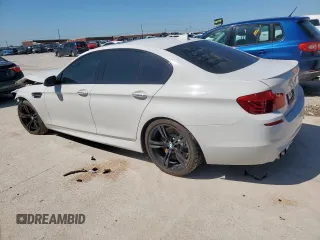 2015 BMW M5 z VIN WBSFV9C54FD594450, wystawiony jako Copart lot #52173915 z przebiegiem 67 267 mil mil oraz Szkoda całkowita • Salvage title. Historia ofert i sprzedaży dostępna na DreamBid. Obrazek 2.