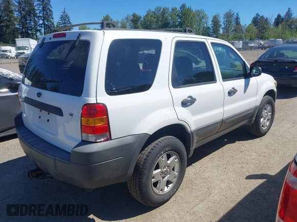 2007 Ford Escape XLT with VIN 1FMYU03127KC05177, listed as a IAAI auction lot 42199281 with 144,846 mi miles and . Bid and sale history available at DreamBid. Image 4.