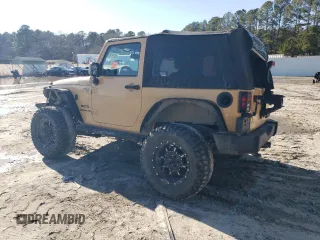 2013 Jeep Wrangler Sport with VIN 1C4AJWAG5DL638636, listed as a Copart auction lot 45197865 with 127,587 mi miles and Salvage title. Bid and sale history available at DreamBid. Image 2.