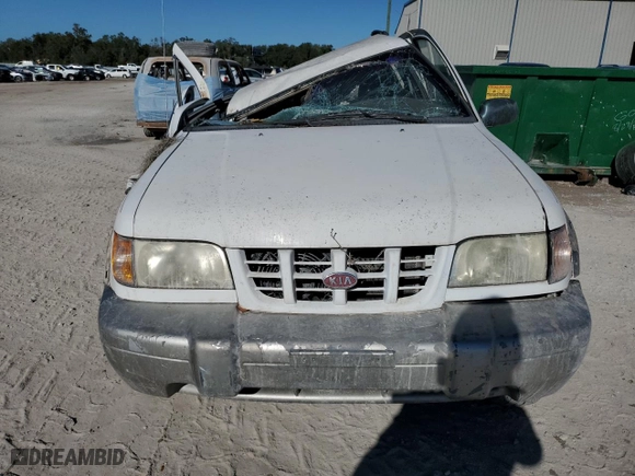 1998 Kia Sportage with VIN KNDJB7232W5569054, listed as a Copart auction lot 82756824 with 106,550 mi miles and Salvage Title. Bid and sale history available at carsss.com. Image 5.