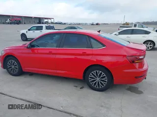 2019 Volkswagen Jetta S z VIN 3VWC57BUXKM099060, wystawiony jako IAAI lot #41478697 z przebiegiem 134 363 mil mil oraz . Historia ofert i sprzedaży dostępna na DreamBid. Obrazek 13.