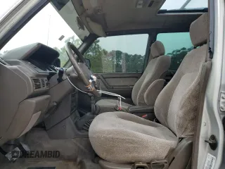 1995 Mitsubishi Montero z VIN JA4MR41H7SJ024208, wystawiony jako Copart lot #42971825 z przebiegiem 313 990 mil mil oraz Szkoda całkowita • Salvage title. Historia ofert i sprzedaży dostępna na DreamBid. Obrazek 7.