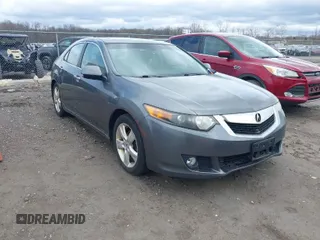 2010 Acura TSX with VIN JH4CU2F60AC015069, listed as a IAAI auction lot 42047083 with 165,671 mi miles. Bid and sale history available at carsss.com. Image 1.