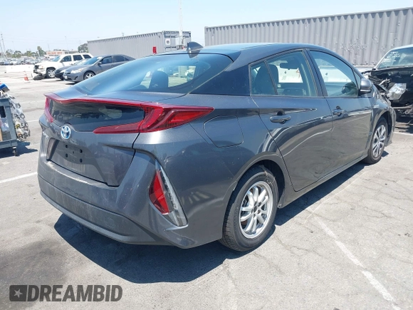 2021 Toyota Prius LE with VIN JTDKAMFPXM3170372, listed as a IAAI auction lot 42661609 with 47,977 mi miles and . Bid and sale history available at DreamBid. Image 4.