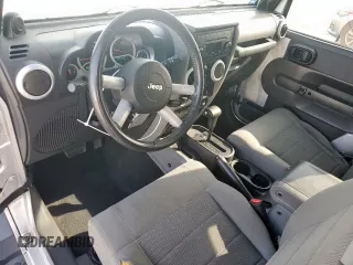 2009 Jeep Wrangler Sahara z VIN 1J4FA54169L780809, wystawiony jako Copart lot #50598925 z przebiegiem 121 078 mil mil oraz Szkoda całkowita • Salvage title. Historia ofert i sprzedaży dostępna na DreamBid. Obrazek 10.
