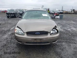 2006 Ford Taurus SE z VIN 1FAFP53U26A197294, wystawiony jako IAAI lot #41506334 z przebiegiem 180 411 mil mil oraz . Historia ofert i sprzedaży dostępna na DreamBid. Obrazek 12.