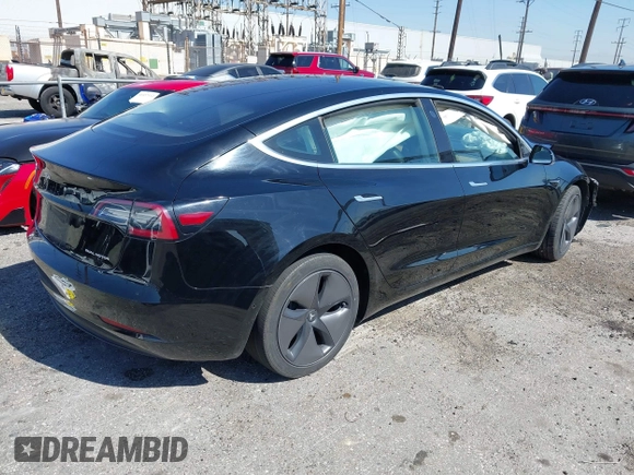 2018 Tesla Model 3 Long Range Battery with VIN 5YJ3E1EB9JF183920, listed as a IAAI auction lot 41657742 with 107,358 mi miles and . Bid and sale history available at DreamBid. Image 4.