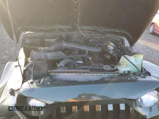 1998 Jeep Wrangler Sahara z VIN 1J4FY49S5WP798505, wystawiony jako Copart lot #88394465 z przebiegiem Nie podano mil oraz Szkoda całkowita • Salvage title. Historia ofert i sprzedaży dostępna na DreamBid. Obrazek 11.