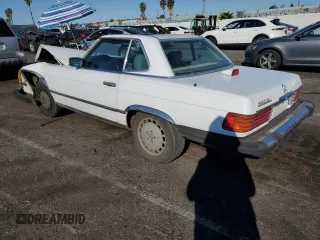 1987 Mercedes-Benz 560 SL with VIN WDBBA48D8HA066224, listed as a Copart auction lot 87976835 with 196,054 mi miles and Salvage Title. Bid and sale history available at DreamBid. Image 2.