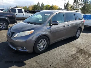 2014 Toyota Sienna XLE with VIN 5TDYK3DC8ES457727, listed as a Copart auction lot 77224224 with 121,879 mi miles and Salvage Title. Bid and sale history available at carsss.com. Image 1.