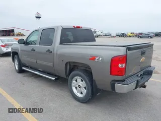 2013 Chevrolet Silverado 1500 LT with VIN 3GCPKSE73DG249856, listed as a IAAI auction lot 41973964 with 135,580 mi miles. Bid and sale history available at carsss.com. Image 3.