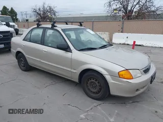 2000 Mazda Protege DX with VIN JM1BJ2223Y0212144, listed as a IAAI auction lot 41570436 with 221,430 mi miles and . Bid and sale history available at DreamBid. Image 1.