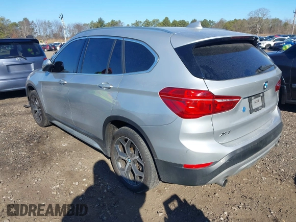 2018 BMW X1 xDrive28i with VIN WBXHT3C30J5L29757, listed as a IAAI auction lot 41879504 with 60,490 mi miles. Bid and sale history available at carsss.com. Image 3.