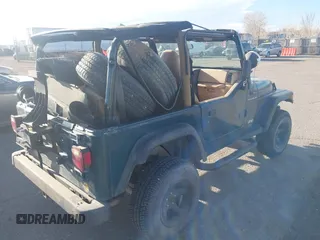 1997 Jeep Wrangler SE with VIN 1J4FY29PXVP409498, listed as a IAAI auction lot 41818698 with 150,086 mi miles. Bid and sale history available at carsss.com. Image 4.