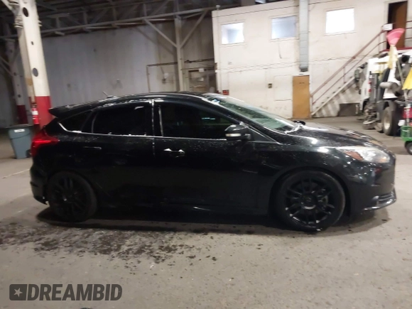 2014 Ford Focus ST with VIN 1FADP3L96EL355713, listed as a IAAI auction lot 41572939 with 102,838 mi miles and . Bid and sale history available at carsss.com. Image 14.