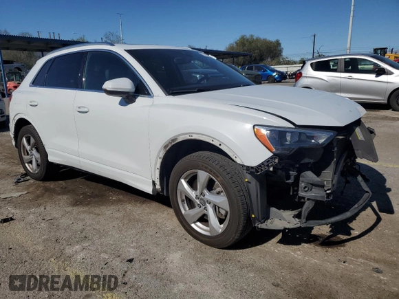 2020 Audi Q3 Premium with VIN WA1AECF30L1023652, listed as a Copart auction lot 57148915 with 69,621 mi miles and Salvage title. Bid and sale history available at DreamBid. Image 4.