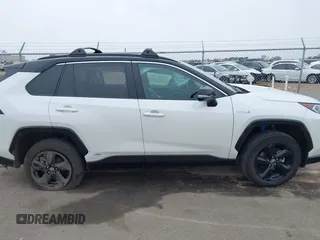 2021 Toyota RAV4 Hybrid XSE with VIN 2T3E6RFV4MW021009, listed as a IAAI auction lot 41940278 with 33,016 mi miles and . Bid and sale history available at DreamBid. Image 13.