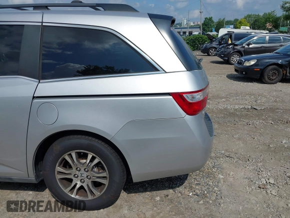 2012 Honda Odyssey EX-L with VIN 5FNRL5H61CB081634, listed as a IAAI auction lot 42760909 with 197,949 mi miles and . Bid and sale history available at DreamBid. Image 12.
