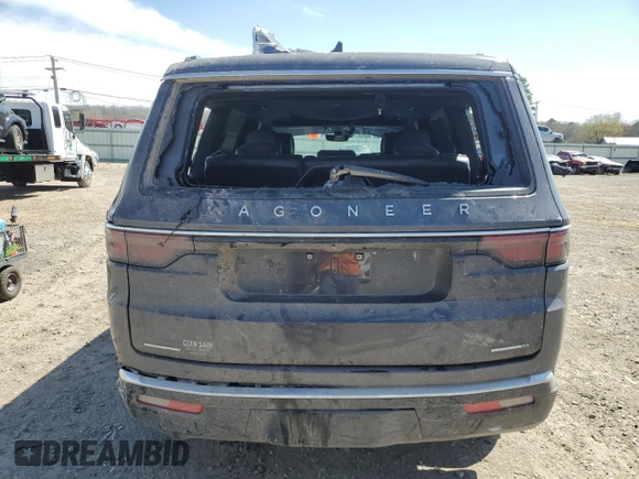 2022 Jeep Wagoneer Series II z VIN 1C4SJVBT2NS107301, wystawiony jako Copart lot #50255875 z przebiegiem 67 709 mil mil oraz Szkody całkowita. Historia ofert i sprzedaży dostępna na DreamBid. Obrazek 6.