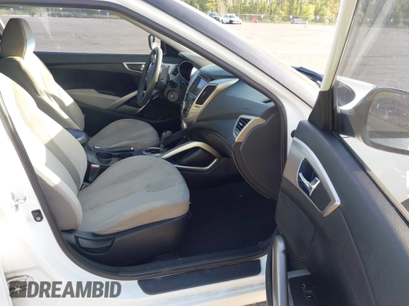 2012 Hyundai Veloster w/Gray Int z VIN KMHTC6AD6CU050886, wystawiony jako IAAI lot #42088918 z przebiegiem 126 007 mil mil oraz . Historia ofert i sprzedaży dostępna na DreamBid. Obrazek 5.