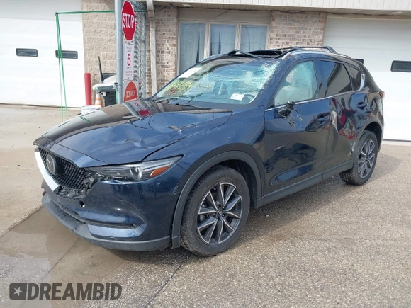 2018 Mazda CX-5 Grand Touring with VIN JM3KFADM1J1439544, listed as a IAAI auction lot 41891134 with 54,132 mi miles and . Bid and sale history available at DreamBid. Image 2.