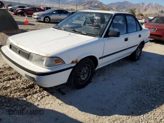 1992 Toyota Corolla z VIN JT2AE94A1N0300157, wystawiony jako Copart lot #77783474 z przebiegiem 180 103 mil mil oraz Czysty tytuł • Clean title. Historia ofert i sprzedaży dostępna na DreamBid. Obrazek 1.