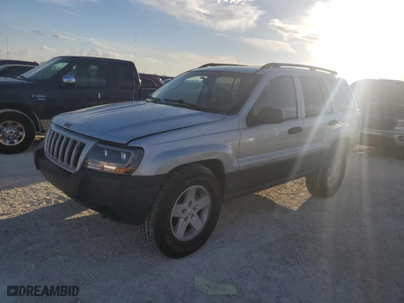 2004 Jeep Grand Cherokee Laredo with VIN 1J4GX48N74C406647, listed as a Copart auction lot 77631654 with 174,824 mi miles and Salvage Title. Bid and sale history available at carsss.com. Image 1.