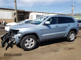 2012 Jeep Grand Cherokee Laredo with VIN 1C4RJFAG5CC222569, listed as a Copart auction lot 53264185 with 153,921 mi miles and Salvage Title. Bid and sale history available at carsss.com. Image 1.