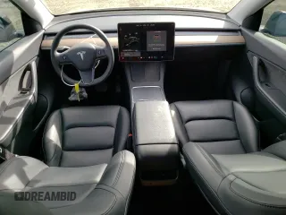 2021 Tesla Model Y Long Range with VIN 5YJYGAEE9MF137910, listed as a Copart auction lot 81921303 with 47,397 mi miles and Salvage Title. Bid and sale history available at DreamBid. Image 8.