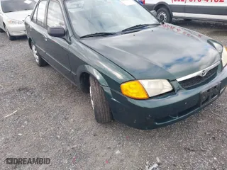 1999 Mazda Protege DX with VIN JM1BJ2226X0152861, listed as a IAAI auction lot 42008276 with 63,152 mi miles. Bid and sale history available at carsss.com. Image 6.