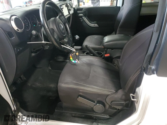 2013 Jeep Wrangler Rubicon 10th Anniversary z VIN 1C4BJWCGXDL543958, wystawiony jako Copart lot #58492255 z przebiegiem 94 455 mil mil oraz Szkoda całkowita • Salvage title. Historia ofert i sprzedaży dostępna na DreamBid. Obrazek 7.