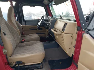 1999 Jeep Wrangler SE with VIN 1J4FY29P6XP408738, listed as a IAAI auction lot 41716999 with 124,692 mi miles. Bid and sale history available at carsss.com. Image 5.
