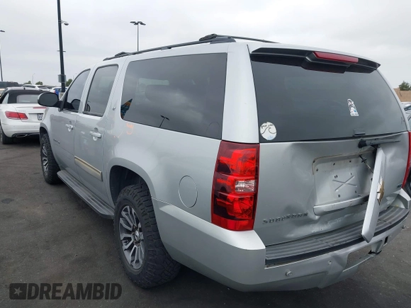 2010 Chevrolet Suburban LT with VIN 1GNUCJE03AR238548, listed as a IAAI auction lot 42104596 with 153,959 mi miles and . Bid and sale history available at DreamBid. Image 3.