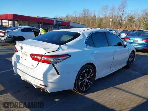 2018 Toyota Camry LE with VIN 4T1B11HK5JU565402, listed as a IAAI auction lot 41824110 with 105,659 mi miles. Bid and sale history available at carsss.com. Image 4.