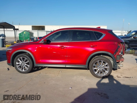 2020 Mazda CX-5 Grand Touring with VIN JM3KFADM7L0729537, listed as a IAAI auction lot 41864569 with 82,998 mi miles. Bid and sale history available at carsss.com. Image 15.