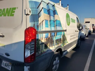 2019 Ford Transit with VIN 1FTYR1YG8KKB48274, listed as a IAAI auction lot 42191093 with 123,479 mi miles and . Bid and sale history available at carsss.com. Image 1.