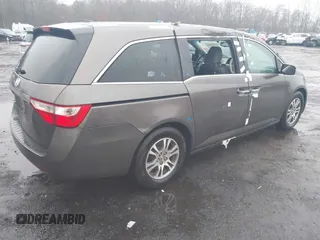 2012 Honda Odyssey EX-L with VIN 5FNRL5H64CB037689, listed as a IAAI auction lot 41857822 with 121,601 mi miles and . Bid and sale history available at carsss.com. Image 4.