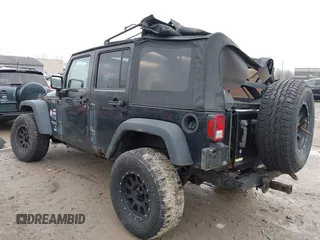 2008 Jeep Wrangler Unlimited X with VIN 1J4GA39138L641138, listed as a IAAI auction lot 41986230 with 215,026 mi miles. Bid and sale history available at carsss.com. Image 3.