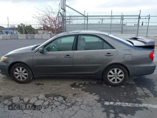 2004 Toyota Camry LE with VIN 4T1BF32K84U588764, listed as a IAAI auction lot 42126345 with 144,642 mi miles. Bid and sale history available at carsss.com. Image 14.