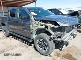 2021 Chevrolet Colorado 4WD Z71 z VIN 1GCGTDEN7M1117558, wystawiony jako IAAI lot #41911673 z przebiegiem 51 838 mil mil oraz . Historia ofert i sprzedaży dostępna na DreamBid. Obrazek 1.