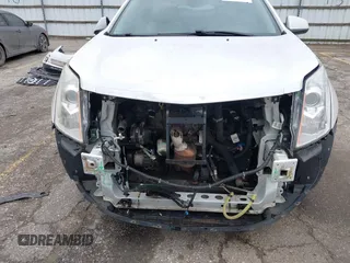 2014 Cadillac SRX Premium Collection z VIN 3GYFNDE34ES548826, wystawiony jako IAAI lot #40792942 z przebiegiem 115 984 mil mil oraz . Historia ofert i sprzedaży dostępna na DreamBid. Obrazek 6.