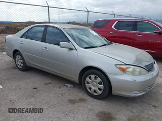 2003 Toyota Camry LE with VIN 4T1BE32K93U143547, listed as a IAAI auction lot 41156936 with 199,043 mi miles and . Bid and sale history available at DreamBid. Image 1.